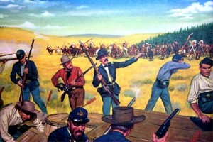 “Good Marksmanship and Guts”  DA Poster 21-45 Near Fort Phil Kearney, Wyoming, 2 August 1867. The Wagon Box Fight is one of the great traditions of the Infantry in the West. A small force of 30 men on the 9th Infantry led by Brevet Major James Powell was suddenly attacked in the early morning hours by some 2,000 Sioux Indians. Choosing to stand and fight, these soldiers hastily erected a barricade of wagon boxes, and during the entire morning stood off charge after charge. The Sioux finally withdrew, leaving behind several hundred killed and wounded. The defending force suffered only three casualties. By their coolness, firmness and confidence these infantrymen showed what a few determined men can accomplish with good marksmanship and guts. 